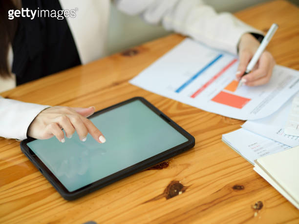 Cropped image of a female worker using digital tablet 이미지 (1366907754 ...