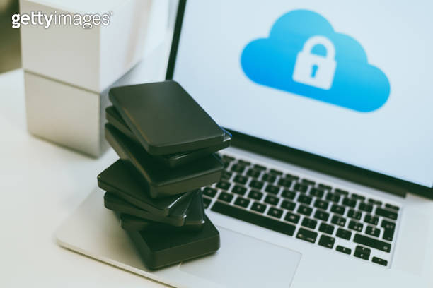 Laptop on the desk with network attached storage. Computer, nas and ...