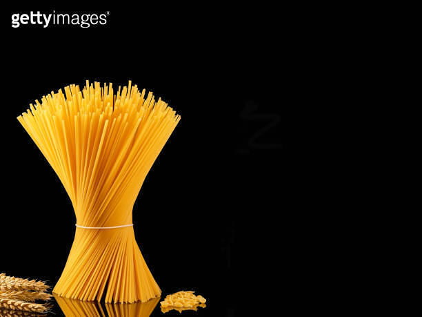 Shell Vs Spaghetti Spaghetti collection isolated on dark background with copy space. Whole ...