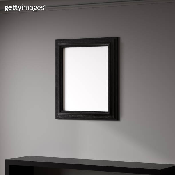 Blank frame on gray wall mock up, vertical black poster frame on wall