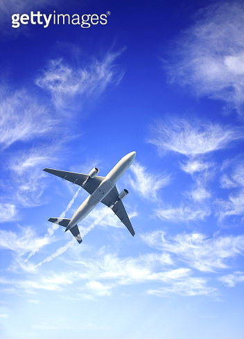 Vertical nature background with aircraft and Jet trailing smoke in the ...