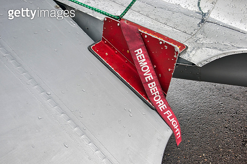 A remove before flight ribbon on a airplane (1423550830) - 게티이미지뱅크