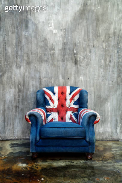 Vintage armchair with Great Britain flag in grunge interior 이미지