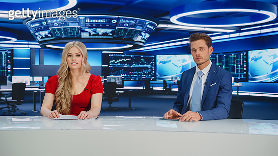 TV Live News Program: Two Presenters Reporting, Discuss Daily Events ...
