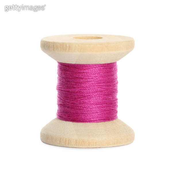 Wooden spool of bright pink sewing thread isolated on white 이미지 ...