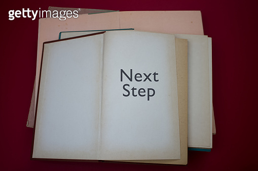 Next Step word in opened book with vintage, natural patterns old ...