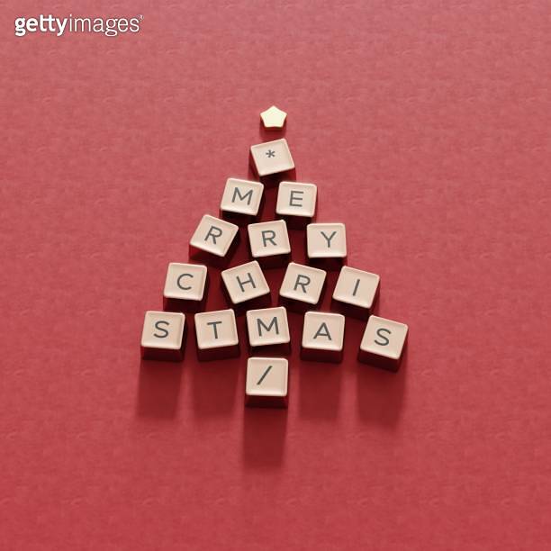 Christmas Tree Symbol made by golden Computer keys cap on red color