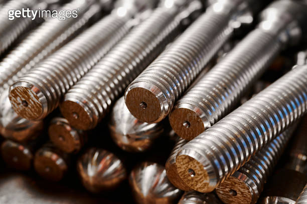 Large shiny bolts stack in plant warehouse macro view 이미지 (1641874554 ...