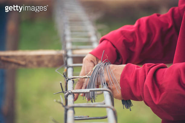 Construction Worker hands using pincer pliers iron wire. Outdoor Worker ...
