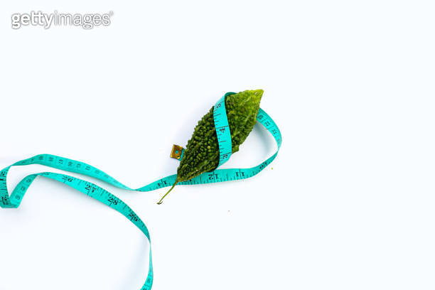Bitter gourd wrapped in measuring tape 이미지 (1456583071) - 게티이미지뱅크