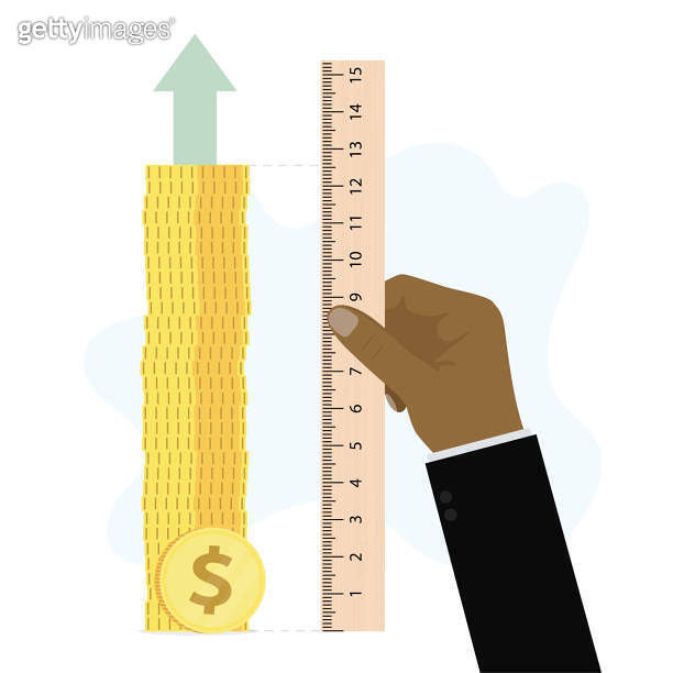 Businessman hand holds large ruler and measures level of profit and ...