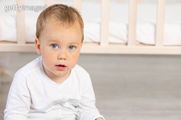 Portrait Of A Cute Little Boy 2 Years Old Near The Crib 1472794125 portrait-of-a-cute-little-boy-2-years-old-near-the-crib-1472794125