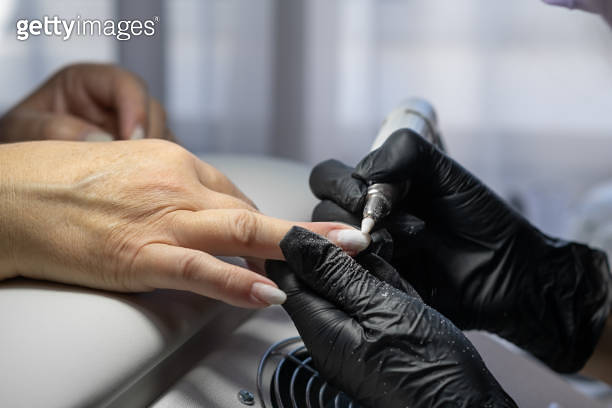 Manicurist At Work Professional Manicurist Removes Worn Nail Design manicurist-at-work-professional-manicurist-removes-worn-nail-design