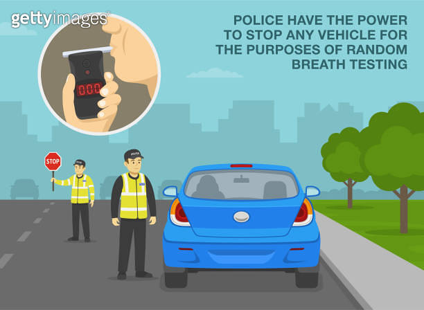 Driver blowing into a tester. Police have the power to stop vehicle for ...