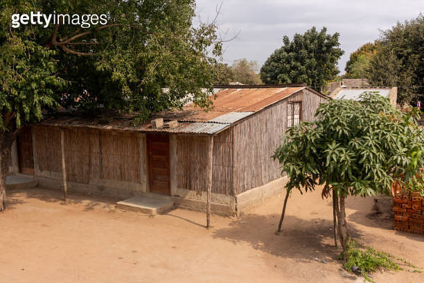 Exterior view of a reed house, common in some parts of Africa, with ...