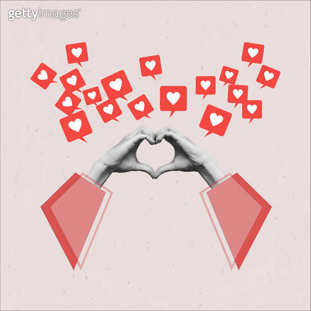 Human female hands in red sleeves showing a heart shape and like