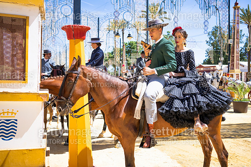 Spanish Riders Crewel Spanish riders in Feria de Jerez dressed in the typical dress with ...