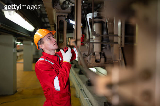 Electric train engineer use a walkie-talkie to inspect electric train ...