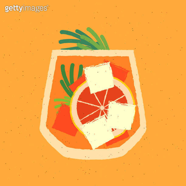 Cold cocktail with tarragon, grapefruit and ice cubes. Tumbler glass