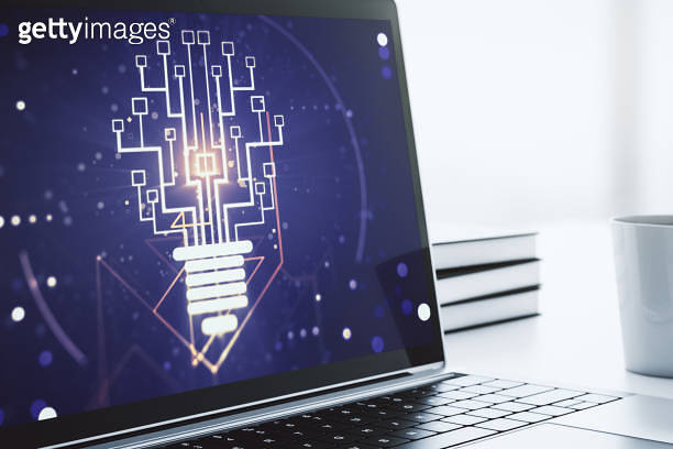 Creative light bulb illustration with microcircuit on modern computer ...