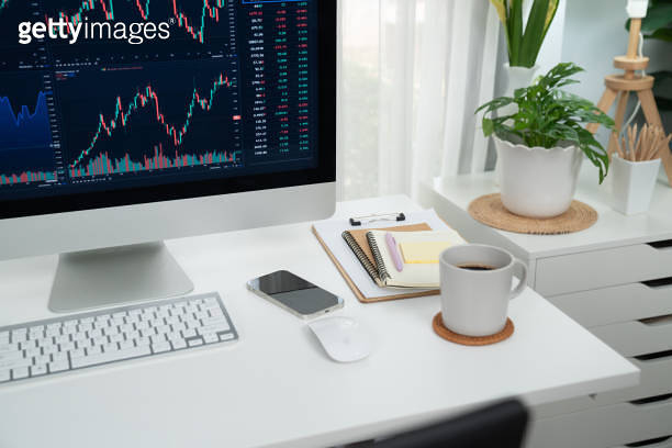 Dynamic stock exchange graph display on computer and laptop screen ...