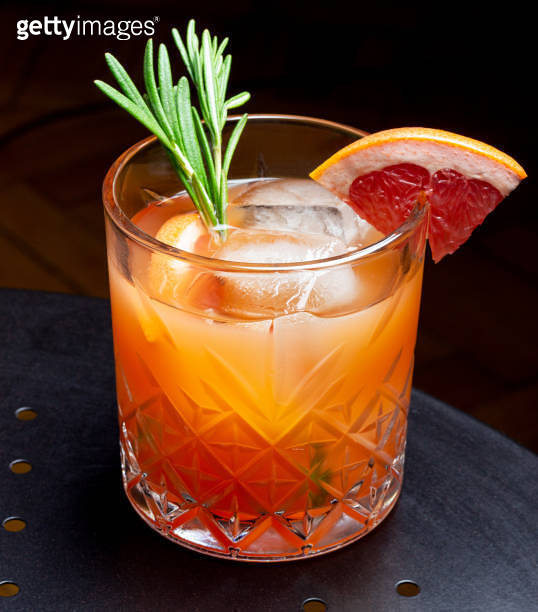 Paloma cocktail with grapefruit, lime and rosemary. Grapefruit juice