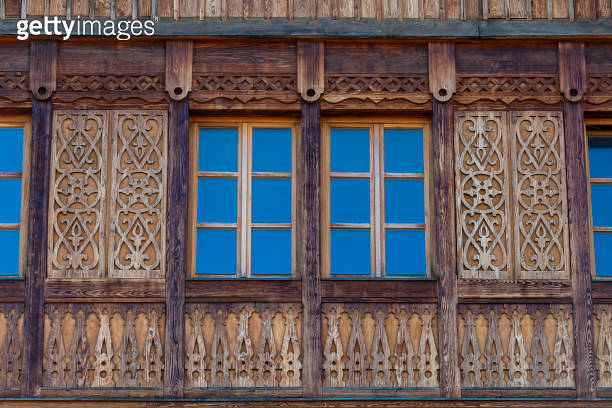 Rustic Function Hall Window Façade Windows on the wooden facade of a rustic house made of wooden beams in ...