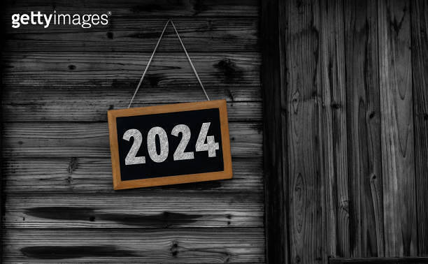 Blackboard with number 2024 hanging on wall 이미지 (1766507352) - 게티이미지뱅크