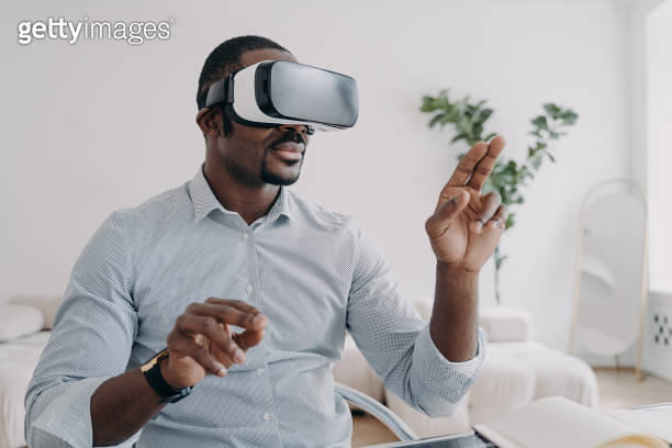 African american man developer in VR glasses use virtual reality ...