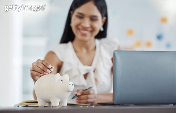 Woman, money and savings with piggy bank in office, desk and workplace ...