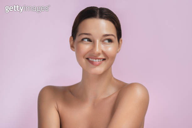 Excited Smiling Brunette Beauty Spa Woman with Naked Shoulders, Undress on Pink Background 이미지