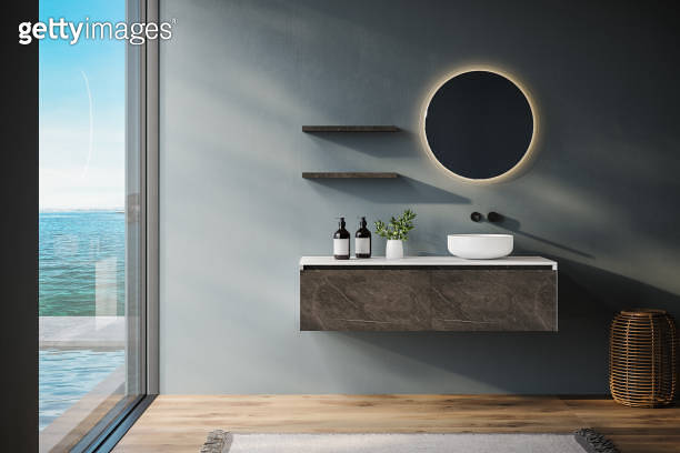 Minimal bathroom with blue tones walls, marble and white vanity, oval ...