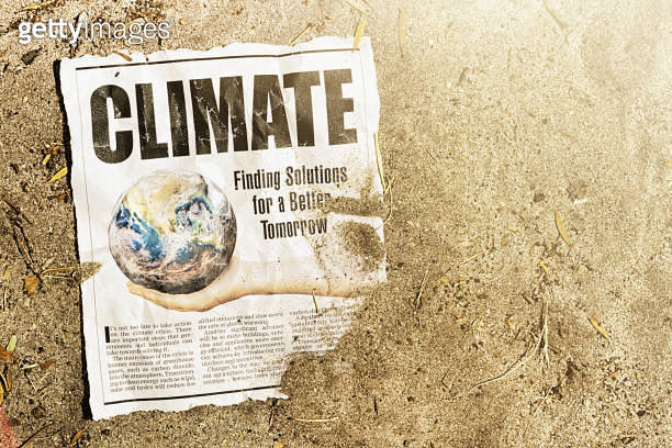 CLIMATE, says big newspaper headline with text about finding solutions ...
