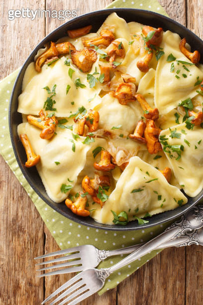 Triangular Italian dumplings pasta triangoli with chanterelle mushrooms ...