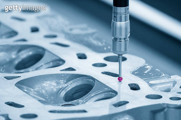 The multi axis CMM machine measuring the aluminum cylinder head parts ...