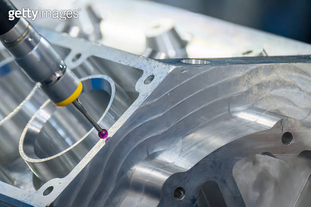 The multi-axis CMM machine measuring the aluminum cylinder block parts ...