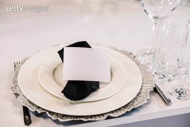 Serving, setting table. Plate decorated linen black napkin, postcard ...