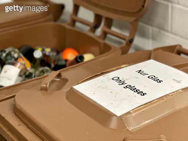 Brown glas only recycling bins in garbage room of German apartment ...