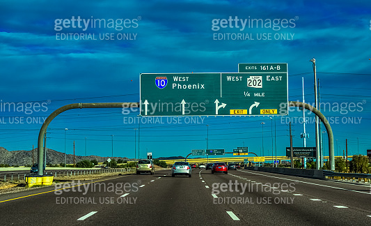 Road signs and information boards (West Phoenix) on the expressway in ...