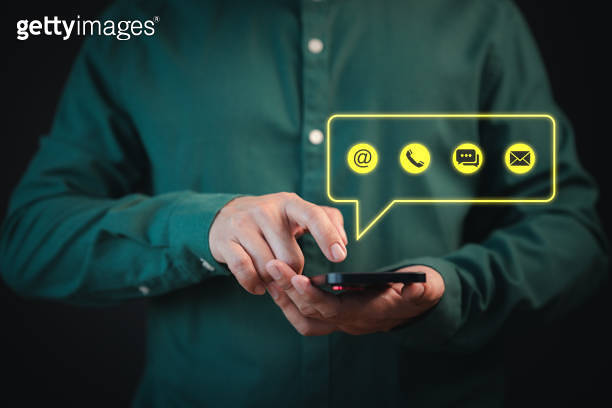 Contact us support hotline, people connect. User man use a smartphone ...