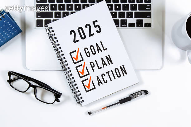 2025 Goal, Plan, Action checklist text on note pad with laptop, glasses ...