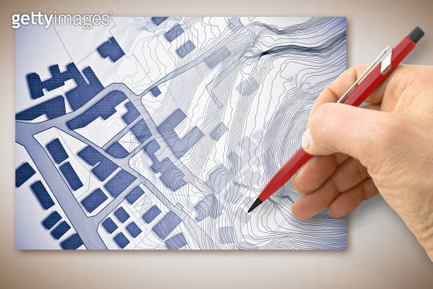 Hand drawing an imaginary cadastral map of territory with buildings ...