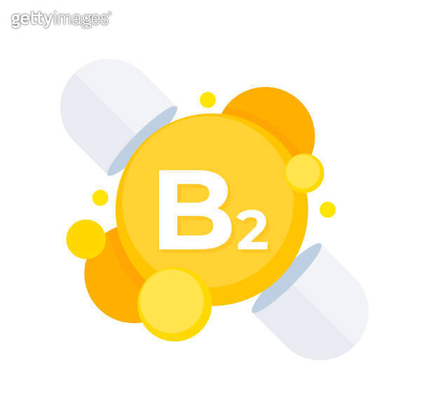 Stylized vitamin B2 riboflavin supplement capsules in a bright yellow