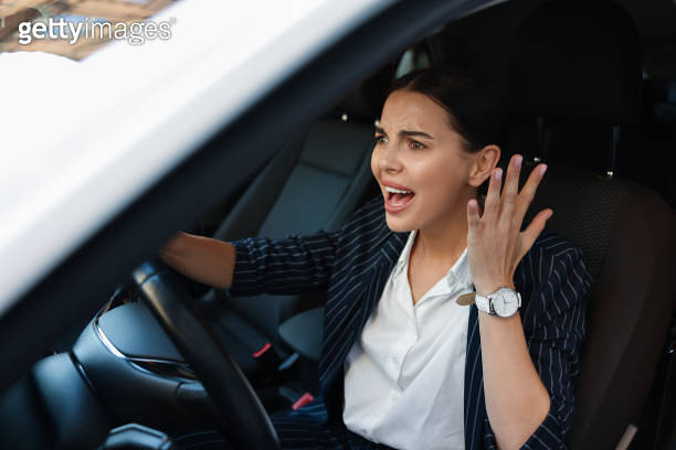 Screaming Train Driver Angry driver screaming in her car. Stuck in traffic jam (1932637051 ...