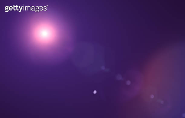 Lens flare glow light effect on black. image of rays purple light ... image.