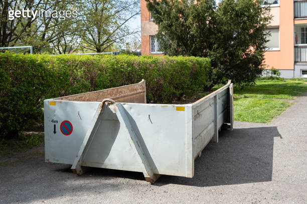 An empty construction waste container ready for materials from a ...