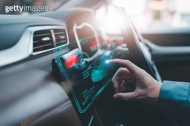 A technician hand interacting with a high-tech holographic car ...