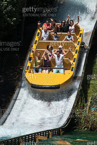 People enjoying a water ride in an amusement park. 이미지 (2126917314 ...