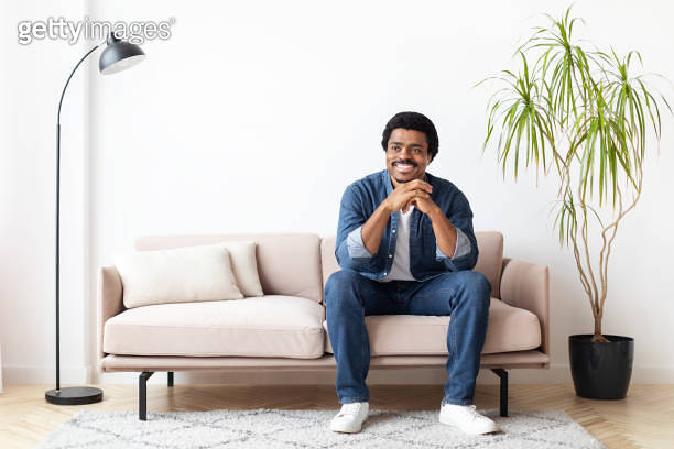 Black Man Sitting On Couch in Living Room And Smiling 이미지 (2156332720 ...